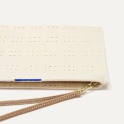 Rothy's The Wristlet - Ivory Perf -Rothy's Shoes Store 093 Wristlet IvoryPerf LayDown 0990