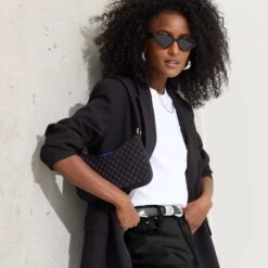 Rothy's The Mini Shoulder Bag - Black Sand -Rothy's Shoes Store 209 BaguetteBag Black On Figure 0776 ffa25f0f d837 4575 93e2 efca672da8b7